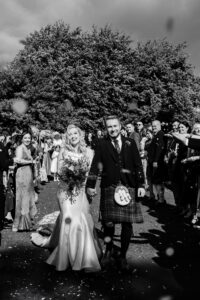 Sherbrooke Castle Glasgow wedding bride and groom have their confetti moment