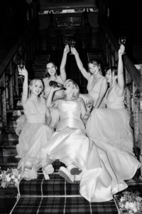 The bridal party shares a drink