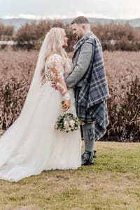 In the gardens of the Lochside, Kelsey and Dylan gaze at each other