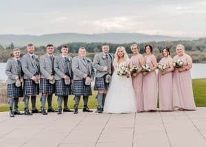 Kelsey and Dylan with their bridal party outside the Lochside House Hotel