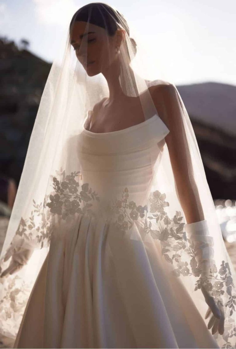 Close up of Coraline styled with a lace-edged veil