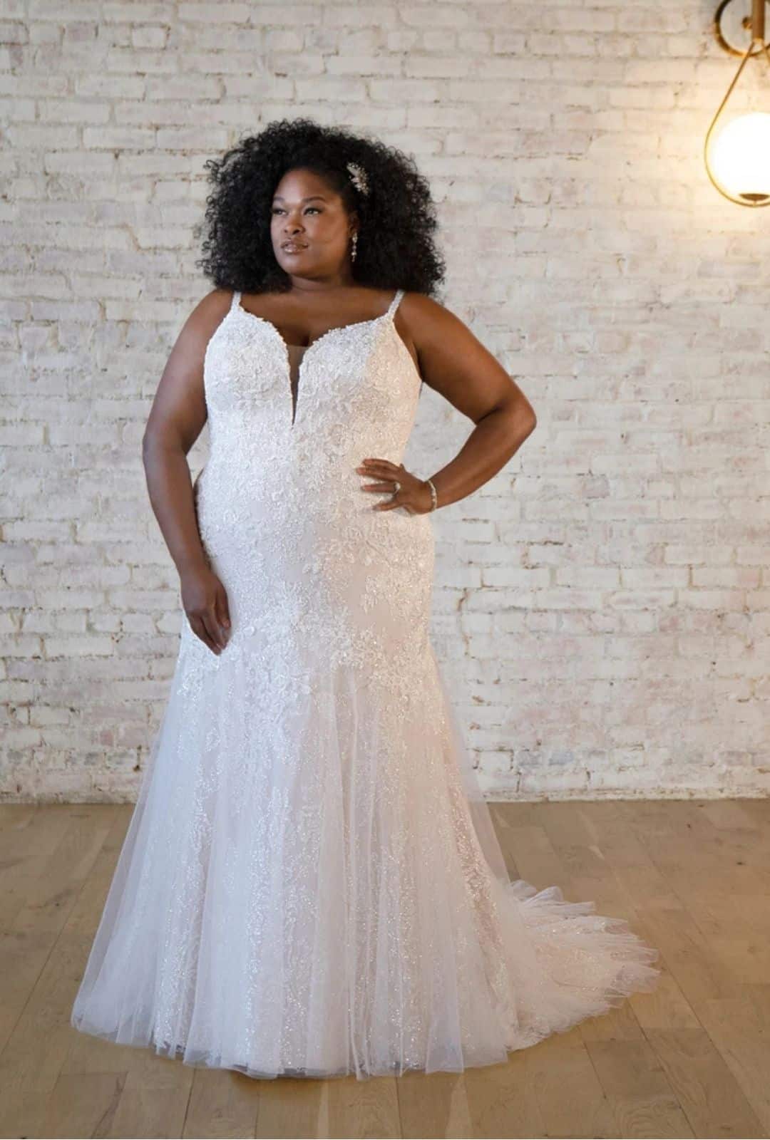 A fitted plus size Stella York wedding dress at Bijoux Bridal, available in sizes 6 to 36