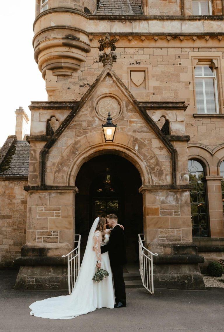 sara-and-craig-outside-their-wedding-venue-cornhill-castle-scotland