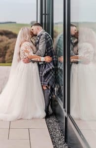 The bride and groom in the grounds of their wedding venue