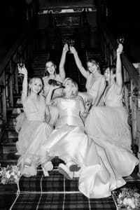 The bridal party shares a drink